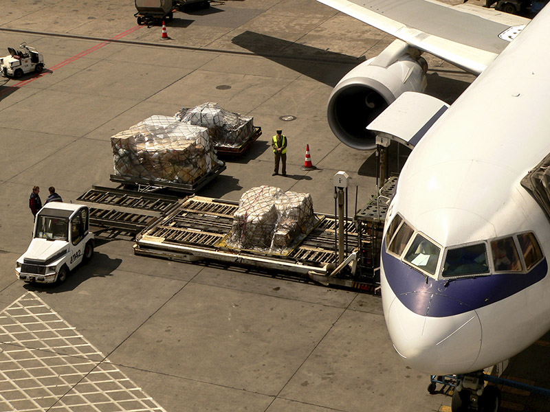 freight being loaded on to airplane
